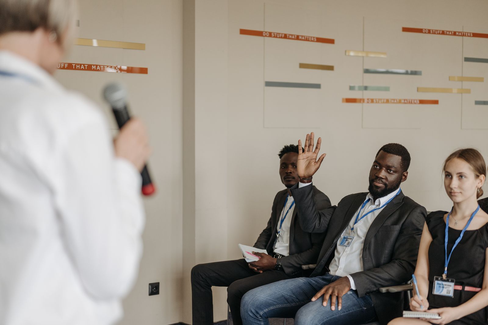 Participants exchanging questions at a professional conference